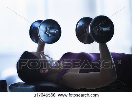 Woman weight lifting View Large Photo Image Stock Photo - Woman weight lifting. Fotosearch