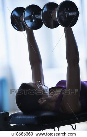 Woman weight lifting View Large Photo Image Stock Photo - Woman weight lifting. Fotosearch