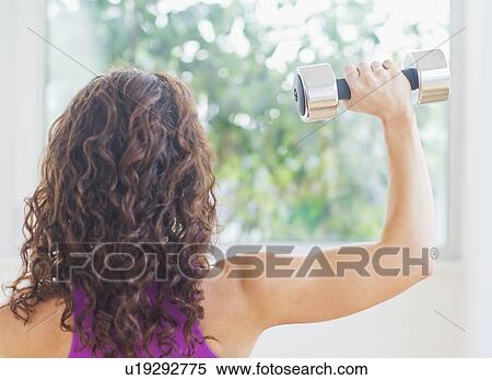 Woman weight lifting View Large Photo Image Stock Photography - Woman weight lifting. Fotosearch