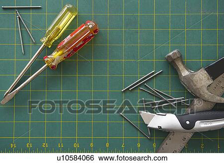 Work tools on grid View Large Photo Image Stock Photograph - Work tools on grid. Fotosearch