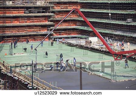 Stock Photo - Workers on construction site. Fotosearch