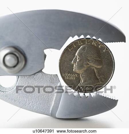 Wrench squeezing coin View Large Photo Image Stock Image - Wrench squeezing coin. Fotosearch