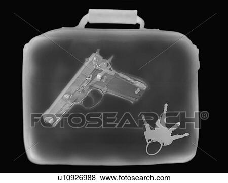 Stock Photo - X-ray image showing handbag containing pistol and set of keys. Fotosearch