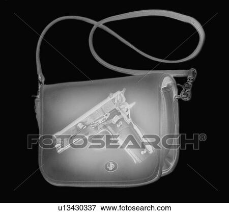 Stock Photo - X-ray image showing handbag containing pistol. Fotosearch