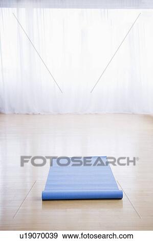 Yoga mat in empty studio View Large Photo Image Stock Photo - Yoga mat in empty studio. Fotosearch