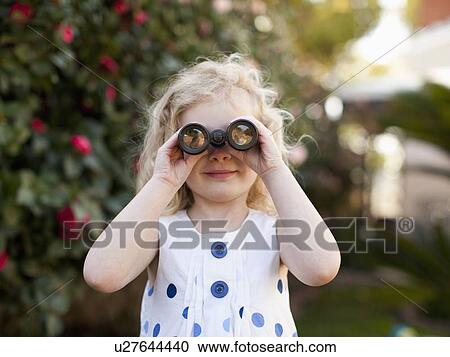 Young girl (4-5) looking through binoculars View Large Photo Image Stock Image - Young girl (4-5) looking through binoculars. Fotosearch