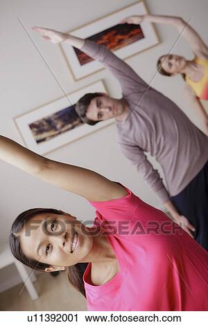 Stock Image - Young people during fitness. Fotosearch