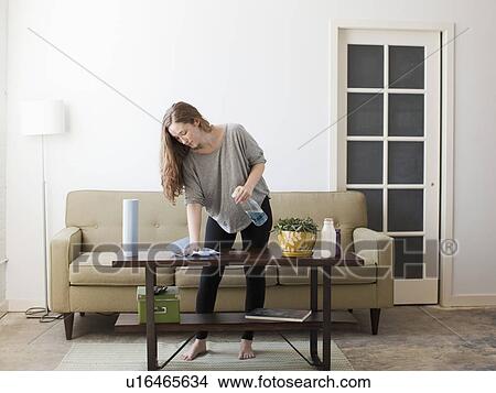 Picture - Young woman cleaning. Fotosearch