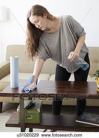Young woman cleaning View Large Photo Image Stock Photo - Young woman cleaning. Fotosearch