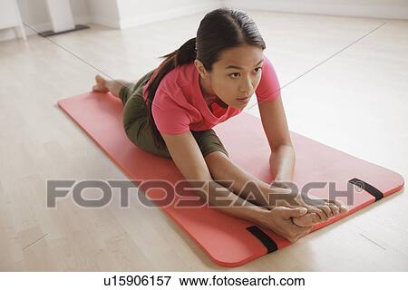 Young woman exercising View Large Photo Image Stock Photo - Young woman exercising. Fotosearch