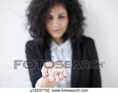 Young woman holding dices View Large Photo Image Stock Image - Young woman holding dices. Fotosearch