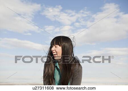 Young woman laughing View Large Photo Image Stock Photo - Young woman laughing. Fotosearch