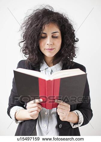 Stock Photo - Young woman r reading book. Fotosearch