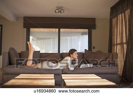 Young woman reading book View Large Photo Image Stock Image - Young woman reading book. Fotosearch