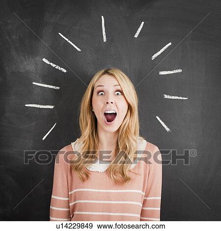 Stock Photo - Young woman with chalk lines around head, studio shot. Fotosearch