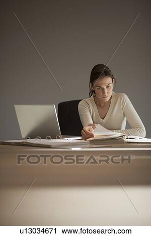 Young woman working from home View Large Photo Image Stock Image - Young woman working from home. Fotosearch
