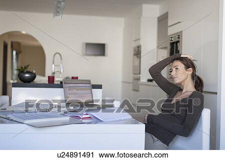 Young woman working from home View Large Photo Image Stock Image - Young woman working from home. Fotosearch