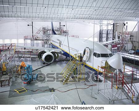 Stock Image - Airplane built in hangar. Fotosearch