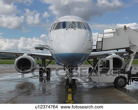 Picture - Airplane sitting on runway. Fotosearch