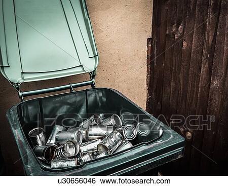 Stock Photograph - Aluminum cans in recycling bin. Fotosearch