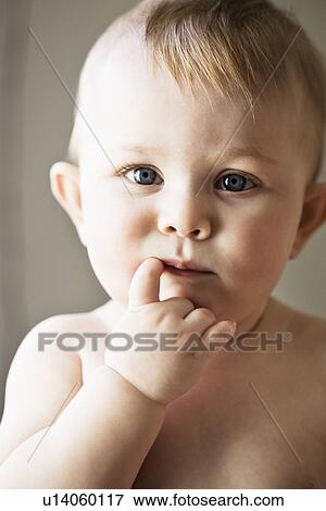 Stock Photo - Baby girl sucking her finger. Fotosearch