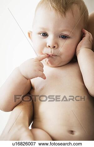 Baby girl sucking her finger View Large Photo Image Stock Photo - Baby girl sucking her finger. Fotosearch