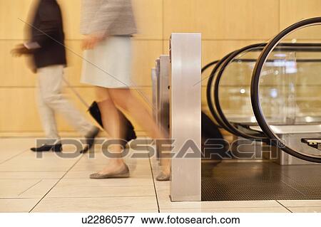 Blurred view of business people in lobby View Large Photo Image Stock Photo - Blurred view of business people in lobby. Fotosearch