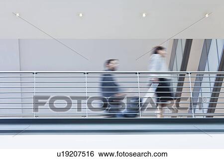 Blurred view of business people View Large Photo Image Stock Photograph - Blurred view of business people. Fotosearch