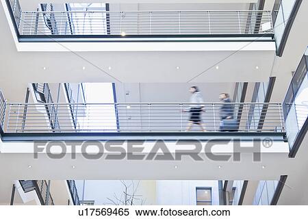 Blurred view of business people View Large Photo Image Stock Photography - Blurred view of business people. Fotosearch
