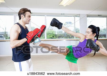 Boxer training with coach in gym View Large Photo Image Stock Image - Boxer training with coach in gym. Fotosearch