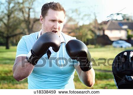 Boxer training with coach outdoors View Large Photo Image Stock Photo - Boxer training with coach outdoors. Fotosearch