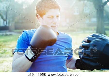 Boxer training with coach outdoors View Large Photo Image Stock Photo - Boxer training with coach outdoors. Fotosearch
