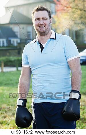 Boxer wearing gloves outdoors View Large Photo Image Stock Image - Boxer wearing gloves outdoors. Fotosearch