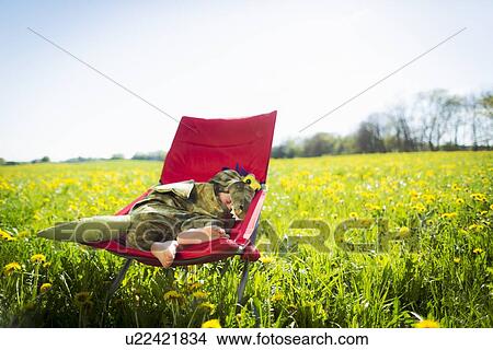 Boy in costume sleeping in chair View Large Photo Image Picture - Boy in costume sleeping in chair. Fotosearch