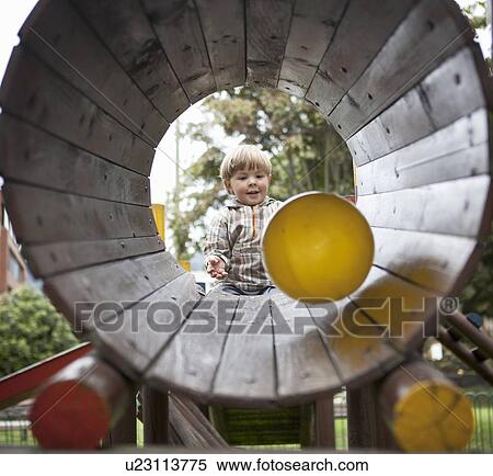 Boy playing with ball on playground View Large Photo Image Stock Photography - Boy playing with ball on playground. Fotosearch