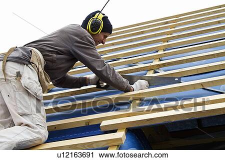 Builder at work on new structure View Large Photo Image Stock Image - Builder at work on new structure. Fotosearch