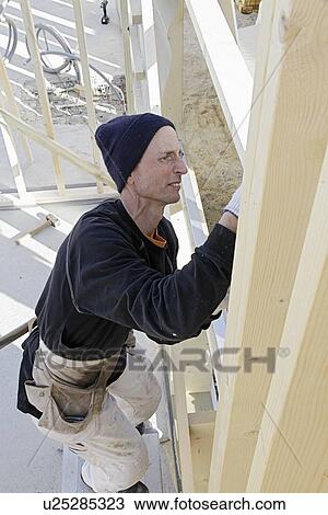 Builder at work on new structure View Large Photo Image Stock Image - Builder at work on new structure. Fotosearch