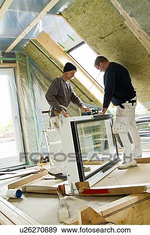 Builders at work on new structure View Large Photo Image Stock Photo - Builders at work on new structure. Fotosearch