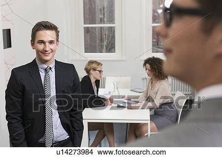 Picture - Business people at work in office. Fotosearch