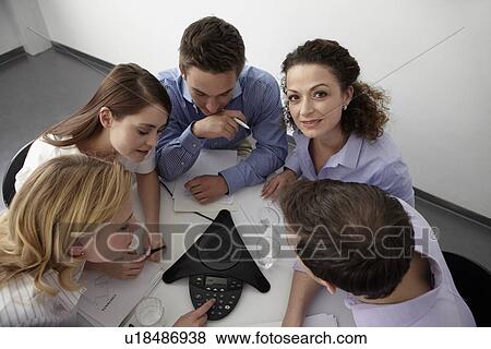 Business people in conference call View Large Photo Image Stock Photo - Business people in conference call. Fotosearch