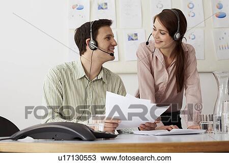 Business people in headsets in office View Large Photo Image Stock Image - Business people in headsets in office. Fotosearch