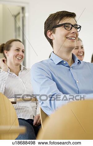 Business people laughing in seminar View Large Photo Image Stock Photo - Business people laughing in seminar. Fotosearch