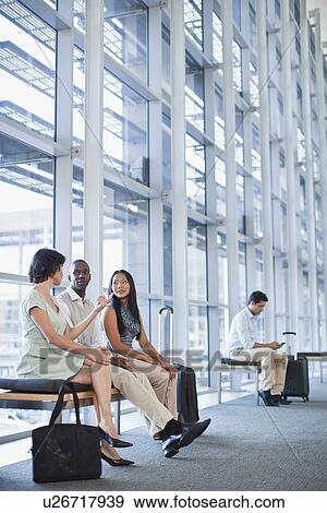 Business people talking in hallway View Large Photo Image Stock Photo - Business people talking in hallway. Fotosearch