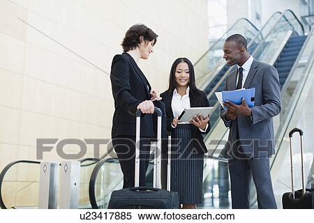 Business people talking in lobby View Large Photo Image Stock Photography - Business people talking in lobby. Fotosearch