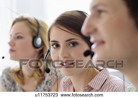 Business people working in headsets View Large Photo Image Stock Image - Business people working in headsets. Fotosearch