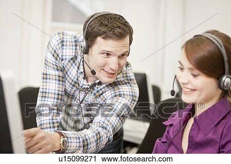 Business people working in headsets View Large Photo Image Stock Image - Business people working in headsets. Fotosearch