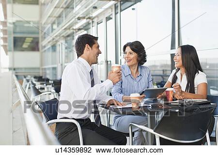 Business people working together in cafe View Large Photo Image Stock Image - Business people working together in cafe. Fotosearch