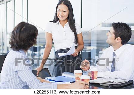 Business people working together in cafe View Large Photo Image Stock Image - Business people working together in cafe. Fotosearch