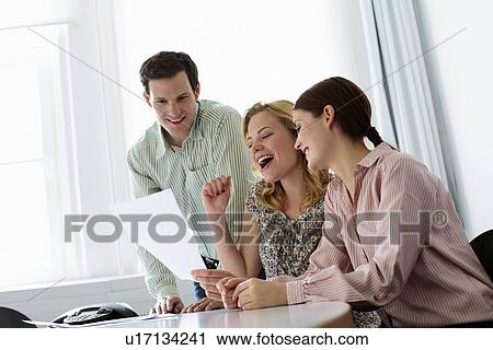 Stock Image - Business people working together. Fotosearch