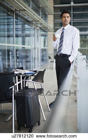 Businessman drinking coffee in cafe View Large Photo Image Stock Image - Businessman drinking coffee in cafe. Fotosearch